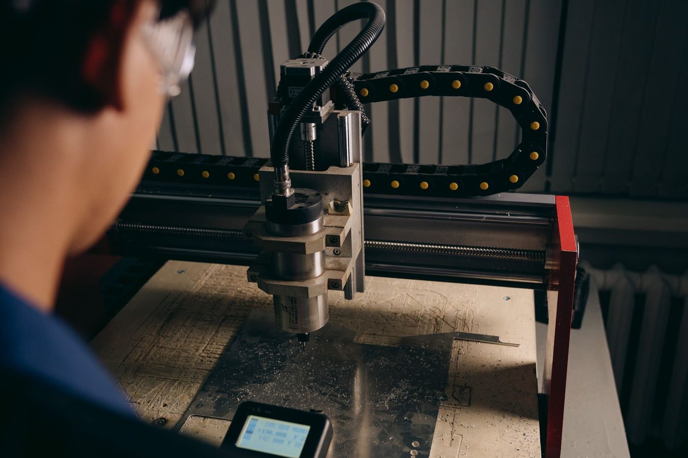 Operator running a CNC router